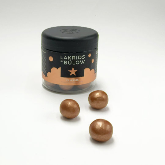 Box liquorice marbles covered with salty dark chocolate, danish