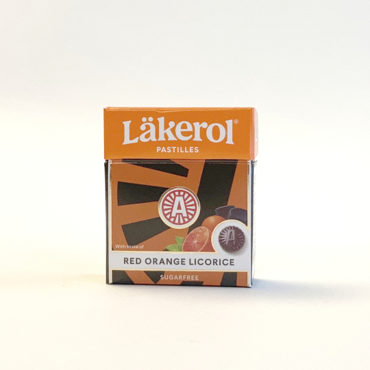 Firm liquorice pastilles with orange and sweetener in a box, swedish