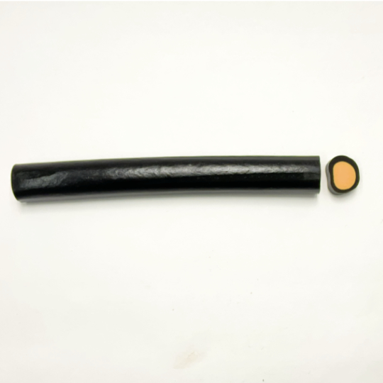 Liquorice cane filled with orange, finnish